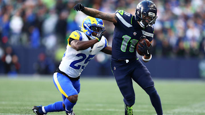 Jan 25, 2026; Seattle, WA, USA; Seattle Seahawks wide receiver Jaxon Smith-Njigba (11) runs against Los Angeles Rams cornerback Roger McCreary (25) during the first half in the 2026 NFC Championship Game at Lumen Field. Mandatory Credit: Kevin Ng-Imagn Images