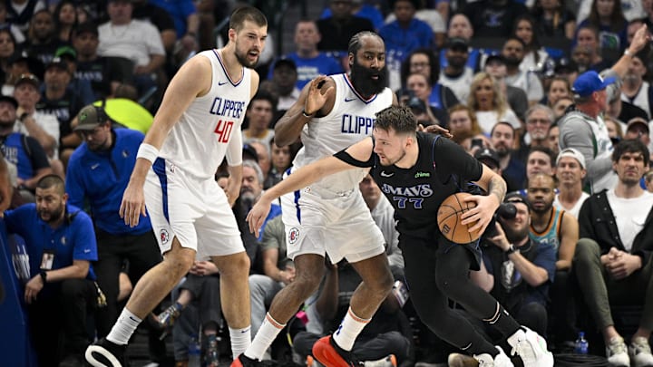May 3, 2024; Dallas, Texas, USA; Dallas Mavericks guard Luka Doncic (77) looks to move the ball past May 3, 2024; Dallas, Texas, USA; Dallas Mavericks guard Luka Doncic (77) looks to move the ball past