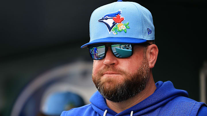 Toronto Blue Jays manager John Schneider (14) looks on during the third inning against the Boston Red Sox  at JetBlue Park at Fenway South