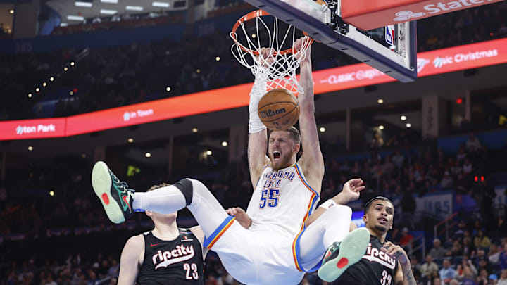 Nov 20, 2024; Oklahoma City, Oklahoma, USA; Oklahoma City Thunder center Isaiah Hartenstein (55) celebrates a dunk between Portland Trail Blazers center Donovan Clingan (23) and forward Toumani Camara (33) during the second half at Paycom Center. Mandatory Credit: Alonzo Adams-Imagn Images