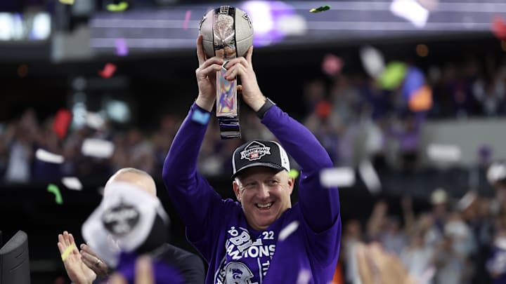 Dec 3, 2022; Arlington, TX, USA;  Kansas State Wildcats head coach Chris Klieman holds up the Big 12 Championship trophy after the game against the TCU Horned Frogs at AT&T Stadium. Mandatory Credit: Kevin Jairaj-USA TODAY Sports
