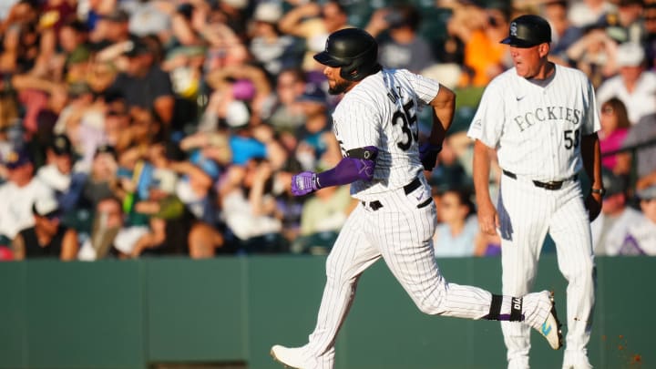 Jul 3, 2024; Denver, Colorado, USA; Colorado Rockies catcher Elias Diaz (35) runs off his double in the fourth inning against the Milwaukee Brewers at Coors Field. Mandatory Credit: Ron Chenoy-USA TODAY Sports