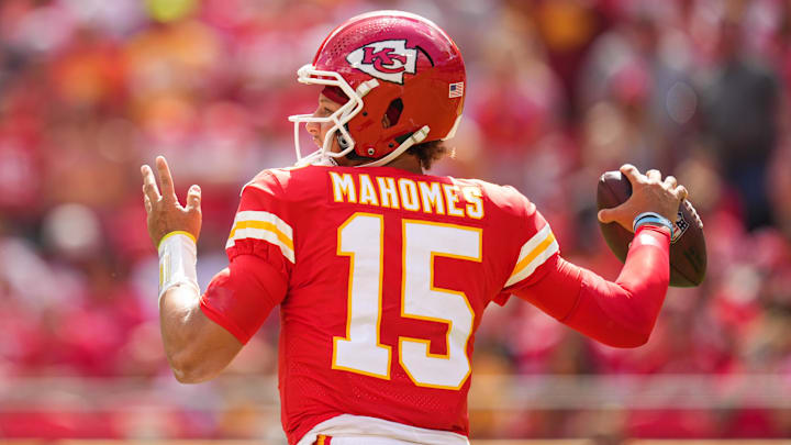 Aug 20, 2022; Kansas City, Missouri, USA; Kansas City Chiefs quarterback Patrick Mahomes (15) throws a pass against the Washington Commanders during the first half at GEHA Field at Arrowhead Stadium. Mandatory Credit: Jay Biggerstaff-Imagn Images