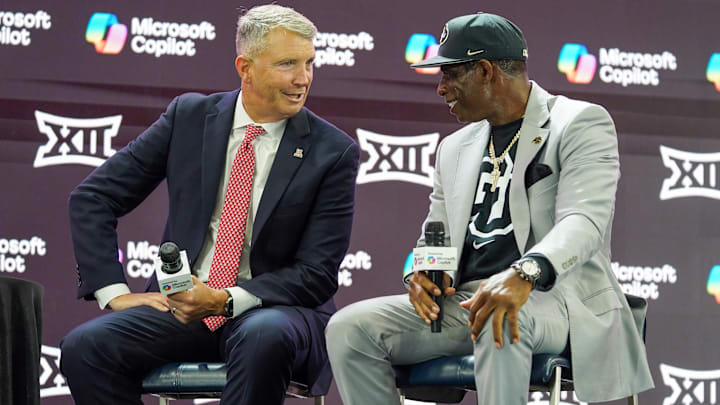 Jul 9, 2025; Frisco, TX, USA; Arizona head coach Brent Brennan and Colorado head coach Deion Sanders talk on stage during 2025 Big 12 Football Media Days at The Star. Mandatory Credit: Raymond Carlin III-Imagn Images Jul 9, 2025; Frisco, TX, USA; Arizona head coach Brent Brennan and Colorado head coach Deion Sanders talk on stage during 2025 Big 12 Football Media Days at The Star. Mandatory Credit: Raymond Carlin III-Imagn Images