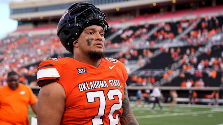Oklahoma State's Isaia Glass (72) walks of the field following the college football between the Oklahoma State University Cowboys and the Utah Utes at Boone Pickens Stadium in Stillwater, Okla., Saturday, Sept., 21, 2024.