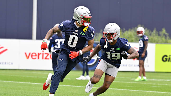 Jun 9, 2025; Foxborough, MA, USA; New England Patriots cornerback Christian Gonzalez (0) and cornerback Kobee Minor (19) run a drill during minicamp at Gillette Stadium. Mandatory Credit: Eric Canha-Imagn Images