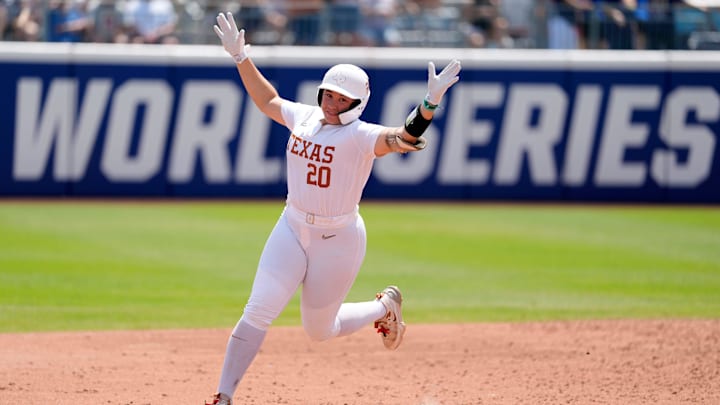 Texas utility Katie Stewart (20) celebrates after hitting a home run.