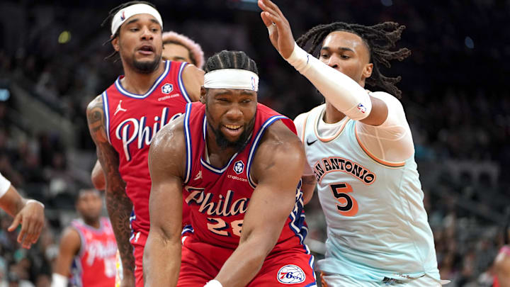 Mar 21, 2025; San Antonio, Texas, USA; Philadelphia 76ers forward Guerschon Yabusele (28) looks to pass against San Antonio Spurs guard Stephon Castle (5) during the fourth quarter at Frost Bank Center. Mandatory Credit: Dustin Safranek-Imagn Images