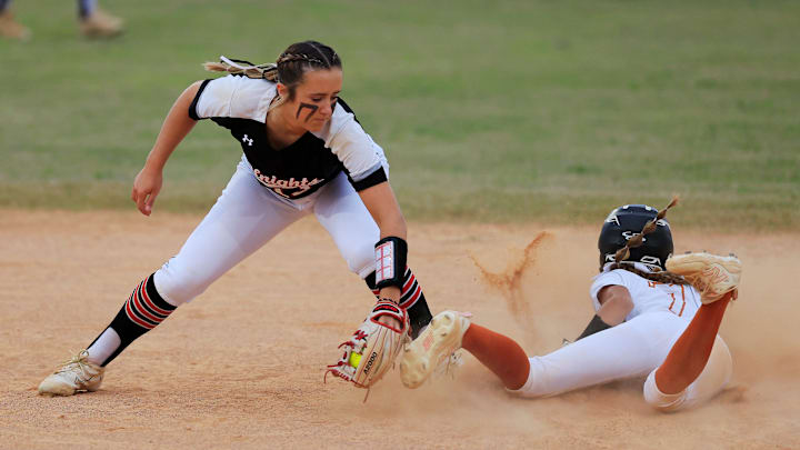 Creekside's Presley Brinkley (13) can’t make the tag in time on Atlantic Coast's Stella Lynton (7) at second base during the second inning of an FHSAA District 1-7A final at Atlantic Coast High School Thursday, May 1, 2025 in Jacksonville, Fla. Atlantic Coast defeated Creekside 19-18 in eight innings. [Corey Perrine/Florida Times-Union]