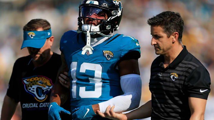 Jacksonville Jaguars wide receiver Christian Kirk (13) leaves the field to the locker room after sustaining an apparent injury during the fourth quarter of an NFL football matchup Sunday, Oct. 27, 2024 at EverBank Stadium in Jacksonville, Fla. The Packers edged the Jaguars 30-27 on a last-second field goal. [Corey Perrine/Florida Times-Union]