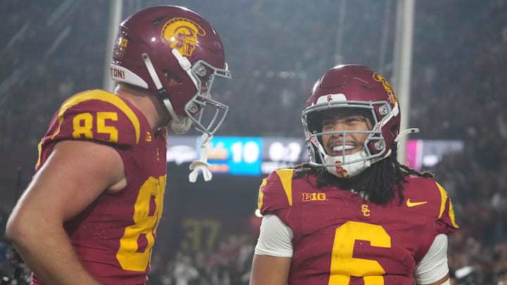 Nov 29, 2025; Los Angeles, California, USA; Southern California Trojans wide receiver Makai Lemon (6) celebrates with tight end Walker Lyons (85) after catching a 32-yard touchdown pass against the UCLA Bruins in the second half at United Airlines Field at Los Angeles Memorial Coliseum. Mandatory Credit: Kirby Lee-Imagn Images