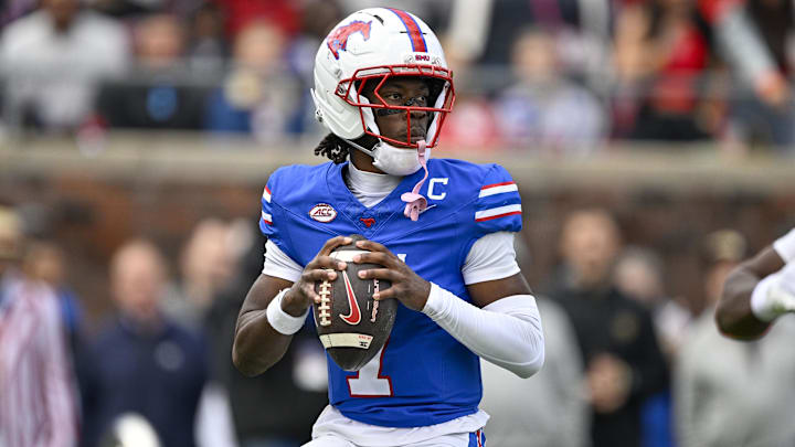 Nov 1, 2025; Dallas, Texas, USA;  SMU Mustangs quarterback Kevin Jennings (7) drops back to pass against the Miami Hurricanes during the second quarter at Gerald J. Ford Stadium. Mandatory Credit: Jerome Miron-Imagn Images