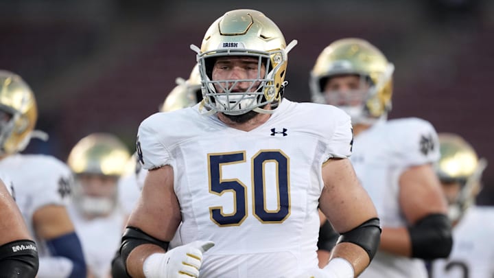 Nov 27, 2021; Stanford, California, USA; Notre Dame Fighting Irish offensive lineman Rocco Spindler (50) jogs on the field before the game against the Stanford Cardinal at Stanford Stadium. Mandatory Credit: Darren Yamashita-Imagn Images