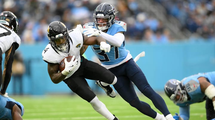 Tennessee Titans safety Amani Hooker tackles Jacksonville Jaguars running back Tank Bigsby. Mandatory Credit: Steve Roberts-Imagn Images Tennessee Titans safety Amani Hooker tackles Jacksonville Jaguars running back Tank Bigsby. Mandatory Credit: Steve Roberts-Imagn Images