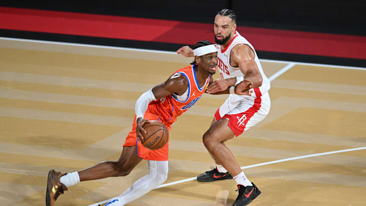Dec 14, 2024; Las Vegas, Nevada, USA; Oklahoma City Thunder guard Shai Gilgeous-Alexander (2) controls the ball against Houston Rockets forward Dillon Brooks (9) during the third quarter in a semifinal of the 2024 Emirates NBA Cup at T-Mobile Arena. Mandatory Credit: Candice Ward-Imagn Images Dec 14, 2024; Las Vegas, Nevada, USA; Oklahoma City Thunder guard Shai Gilgeous-Alexander (2) controls the ball against Houston Rockets forward Dillon Brooks (9) during the third quarter in a semifinal of the 2024 Emirates NBA Cup at T-Mobile Arena. Mandatory Credit: Candice Ward-Imagn Images