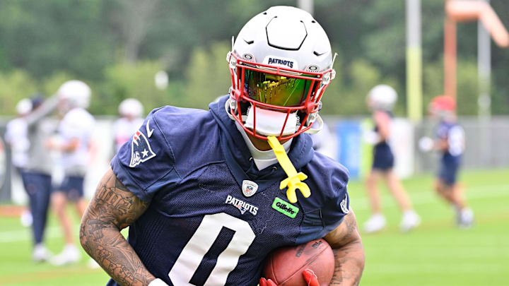 Jun 9, 2025; Foxborough, MA, USA; New England Patriots cornerback Christian Gonzalez (0) runs after the catch during minicamp at Gillette Stadium. Mandatory Credit: Eric Canha-Imagn Images