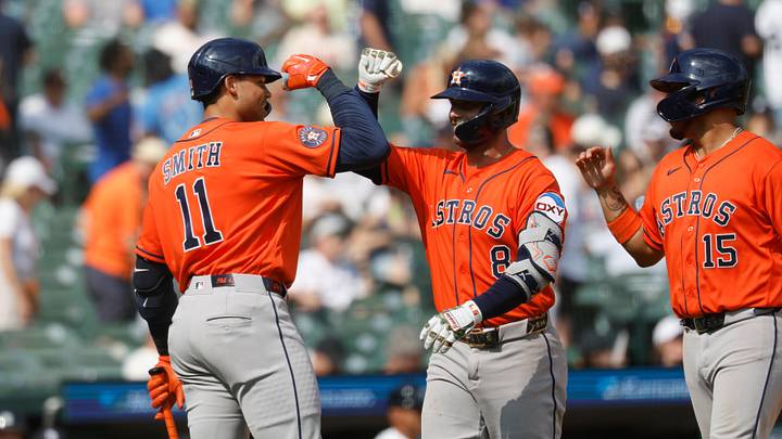  Houston Astros first baseman Christian Walker (8) receives congratulations from Houston Astros right fielder Cam Smith (11).