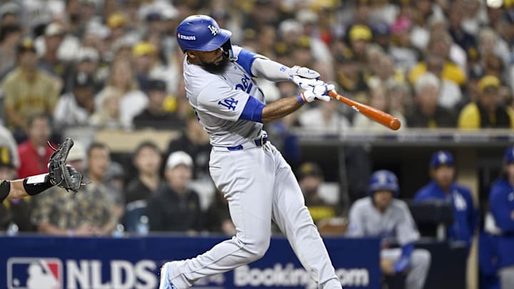 Oct 8, 2024; San Diego, California, USA; Los Angeles Dodgers outfielder Teoscar Hernandez (37) hits a grand slam in the third inning against the San Diego Padres during game three of the NLDS for the 2024 MLB Playoffs at Petco Park.  Mandatory Credit: Denis Poroy-Imagn Images