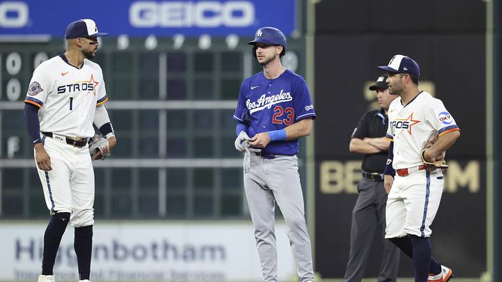 May 4, 2026; Houston, Texas, USA; Los Angeles Dodgers right fielder Kyle Tucker (23) talks with Houston Astros shortstop Carlos Correa (1) and second baseman Jose Altuve (27) during the first inning at Daikin Park. Mandatory Credit: Troy Taormina-Imagn Images