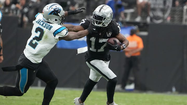 Sep 22, 2024; Paradise, Nevada, USA; Las Vegas Raiders wide receiver Davante Adams (17) carries the ball against Carolina Panthers cornerback Michael Jackson (2) in the first half at Allegiant Stadium. Sep 22, 2024; Paradise, Nevada, USA; Las Vegas Raiders wide receiver Davante Adams (17) carries the ball against Carolina Panthers cornerback Michael Jackson (2) in the first half at Allegiant Stadium.