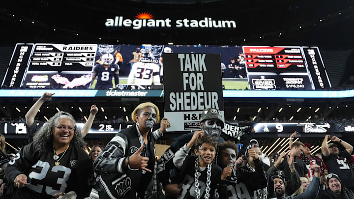 Dec 16, 2024; Paradise, Nevada, USA; Las Vegas Raiders fans hold a sign that reads Tank for Shedeur Sanders during the game against the Atlanta Falcons at Allegiant Stadium. Mandatory Credit: Kirby Lee-Imagn Images