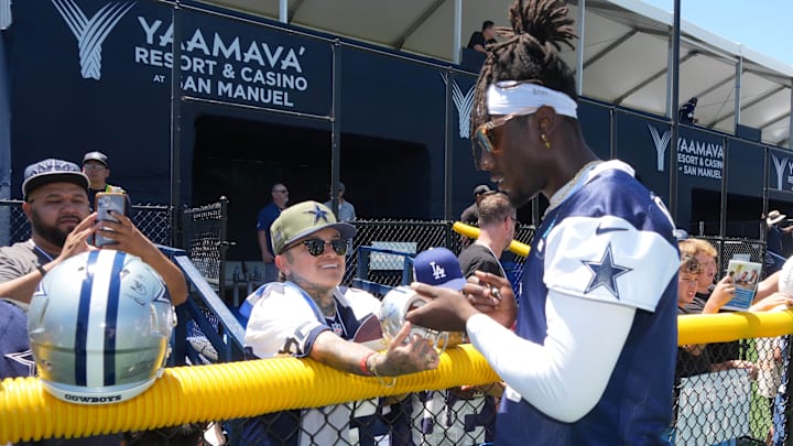 Dallas Cowboys linebacker DeMarvion Overshown signs autographs at training camp at the River Ridge Fields. Dallas Cowboys linebacker DeMarvion Overshown signs autographs at training camp at the River Ridge Fields.