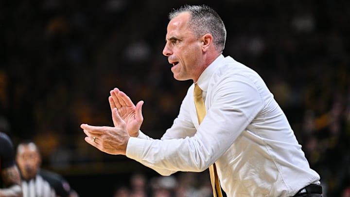 Dec 6, 2025; Iowa City, Iowa, USA; Iowa Hawkeyes head coach Ben McCollum reacts during the first half against the Maryland Terrapins at Carver-Hawkeye Arena. Mandatory Credit: Jeffrey Becker-Imagn Images