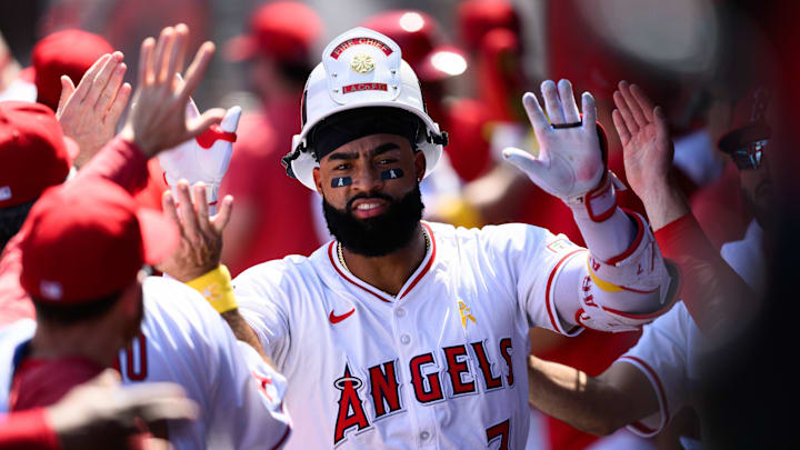 Sep 7, 2025; Anaheim, California, USA; Los Angeles Angels right fielder Jo Adell (7) is greeted by teammates after hitting a two run home run against the Athletics during the first inning at Angel Stadium. Mandatory Credit: William Liang-Imagn Images