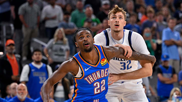 Oct 6, 2025; Fort Worth, Texas, USA; Oklahoma City Thunder guard Cason Wallace (22) and Dallas Mavericks forward Cooper Flagg (32) during the game between the Dallas Mavericks and the Oklahoma City Thunder at Dickie's Arena. Mandatory Credit: Jerome Miron-Imagn Images