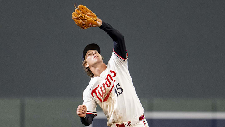 Sep 3, 2025; Minneapolis, Minnesota, USA; Minnesota Twins second baseman Luke Keaschall (15) catches a fly ball against the Chicago White Sox in the ninth inning at Target Field. Mandatory Credit: Jesse Johnson-Imagn Images