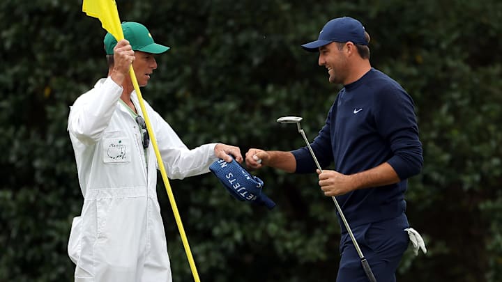 Scottie Scheffler celebrates after shooting a blistering 67, five-under par round on Friday to build a five stroke lead at The Masters.