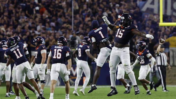Sep 26, 2025; Charlottesville, Virginia, USA; Virginia Cavaliers defensive lineman Hunter Osborne (15) Cavaliers wide receiver Suderian Harrison (1) celebrate after making a stop on a fourth down against the Florida State Seminoles during the fourth quarter at Scott Stadium. Mandatory Credit: Geoff Burke-Imagn Images Sep 26, 2025; Charlottesville, Virginia, USA; Virginia Cavaliers defensive lineman Hunter Osborne (15) Cavaliers wide receiver Suderian Harrison (1) celebrate after making a stop on a fourth down against the Florida State Seminoles during the fourth quarter at Scott Stadium. Mandatory Credit: Geoff Burke-Imagn Images