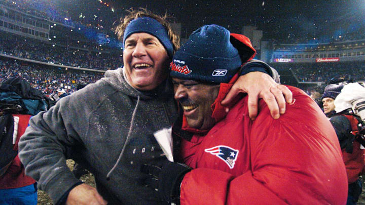 2005: Patriots head coach Bill Belichick celebrates with then-defensive coordinator Romeo Crennel after New England defeated the Indianapolis Colts to advance to the AFC Championship game.