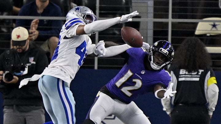 Dallas Cowboys cornerback Zion Childress breaks up a pass intended for Baltimore Ravens wide receiver Malik Cunningham.