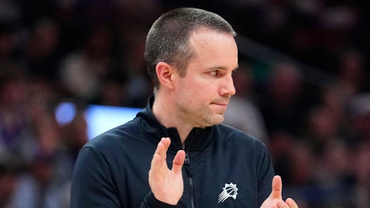 Suns head coach Jordan Ott claps for his team against the Bucks during a game at the Mortgage Matchup Center in Phoenix, on March 21, 2026.