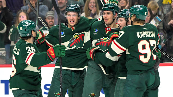Apr 9, 2025; Saint Paul, Minnesota, USA;  Minnesota Wild forward Joel Eriksson Ek (14) celebrates with forward Mats Zuccarello (36), forward Joel Eriksson Ek (14), forward Marco Rossi (23) and forward Kiril Kaprizov (97) after completing a hat trick on a power play goal against the San Jose Sharks during the third period at Xcel Energy Center. Mandatory Credit: Nick Wosika-Imagn Images