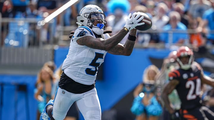 Sep 29, 2024; Charlotte, North Carolina, USA; Carolina Panthers wide receiver Diontae Johnson (5) catches a pass from quarterback Andy Dalton (14) for a touchdown during the third quarter at Bank of America Stadium. Mandatory Credit: Jim Dedmon-Imagn Images