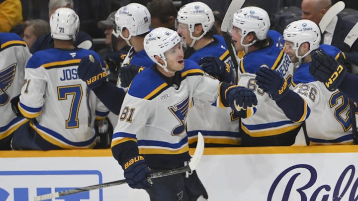 Mar 27, 2025; Nashville, Tennessee, USA;  St. Louis Blues center Dylan Holloway (81) against the Nashville Predators during the third period at Bridgestone Arena. Mandatory Credit: Steve Roberts-Imagn Images