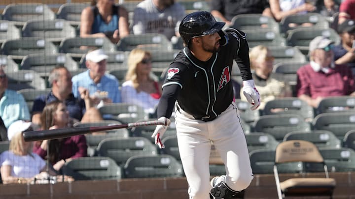 Arizona Diamondbacks shortstop Jordan Lawlar (10) tosses his bat while batting against the Cleveland Guardians during a spring training game at Salt River Fields on Feb. 24, 2025.