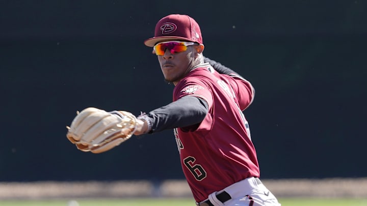 Diamondbacks minor league infielder Manuel Pena throws during a select training camp at Salt River Fields on Feb. 21, 2022.

Baseball Diamondbacks Select Minor League Camp