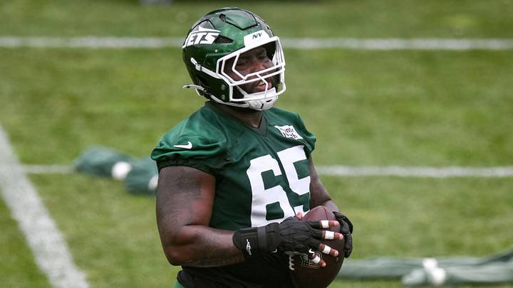 New York Jets offensive lineman Xavier Newman (65) participates in a drill during minicamp at Atlantic Health Jets Training Center.