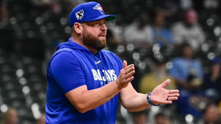 Apr 15, 2026; Milwaukee, Wisconsin, USA;  Toronto Blue Jays manager John Schneider makes a pitching change in the seventh inning against the Milwaukee Brewers at American Family Field. 