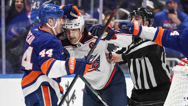 Jan 20, 2025; Elmont, New York, USA;  New York Islanders center Jean-Gabriel Pageau (44) and Columbus Blue Jackets left wing James van Riemsdyk (21) fight in the third period at UBS Arena. Mandatory Credit: Wendell Cruz-Imagn Images