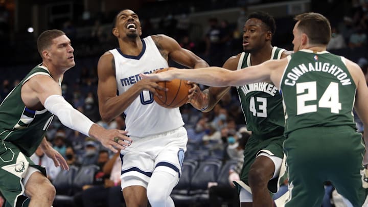 Oct 5, 2021; Memphis, Tennessee, USA; Memphis Grizzlies guard De'Anthony Melton (0) drives to the basket against Milwaukee Bucks center Brook Lopez (left) and forward Thanasis Antetokounmpo (43) and guard Pat Connaughton (24) during the first half at FedExForum. Mandatory Credit: Petre Thomas-Imagn Images Oct 5, 2021; Memphis, Tennessee, USA; Memphis Grizzlies guard De'Anthony Melton (0) drives to the basket against Milwaukee Bucks center Brook Lopez (left) and forward Thanasis Antetokounmpo (43) and guard Pat Connaughton (24) during the first half at FedExForum. Mandatory Credit: Petre Thomas-Imagn Images