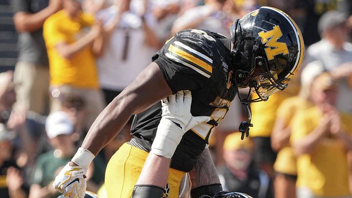 Oct 10, 2026; Columbia, Missouri, USA; Missouri Tigers running back Jamal Roberts (20) celebrates with offensive lineman Tristan Wilson (73) after scoring against the Texas A&M Aggies during the second half of the game at Faurot Field at Memorial Stadium. Mandatory Credit: Denny Medley-Imagn Images Oct 10, 2026; Columbia, Missouri, USA; Missouri Tigers running back Jamal Roberts (20) celebrates with offensive lineman Tristan Wilson (73) after scoring against the Texas A&M Aggies during the second half of the game at Faurot Field at Memorial Stadium. Mandatory Credit: Denny Medley-Imagn Images