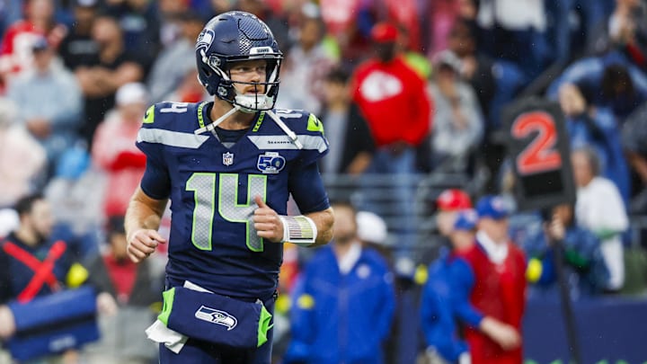 Aug 15, 2025; Seattle, Washington, USA; Seattle Seahawks quarterback Sam Darnold (14) reacts following a rushing touchdown by a teammate against the Kansas City Chiefs during the first quarter at Lumen Field. Mandatory Credit: Joe Nicholson-Imagn Images