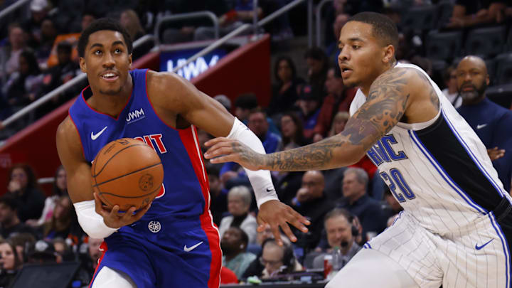 Feb 4, 2024; Detroit, Michigan, USA; Detroit Pistons guard Jaden Ivey (23) dribbles defended by Orlando Magic guard Markelle Fultz (20): Rick Osentoski-USA TODAY Sports