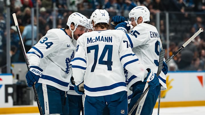 Jan 31, 2026; Vancouver, British Columbia, CAN; Toronto Maple Leafs forward Auston Matthews (34) and  defenseman Troy Stecher (28) and forward Max Domi (11) and defenseman Oliver Ekman-Larsson (95) and forward Bobby McMann (74) celebrate Domi’s goal against the Vancouver Canucks in the third period at Rogers Arena. Mandatory Credit: Bob Frid-Imagn Images