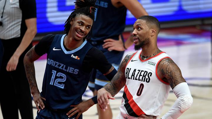 Apr 25, 2021; Portland, Oregon, USA; Memphis Grizzlies guard Ja Morant (12) and Portland Trail Blazers guard Damian Lillard (0) share a moment during the second half of the game at Moda Center. The Grizzlies won 120-113. Apr 25, 2021; Portland, Oregon, USA; Memphis Grizzlies guard Ja Morant (12) and Portland Trail Blazers guard Damian Lillard (0) share a moment during the second half of the game at Moda Center. The Grizzlies won 120-113.