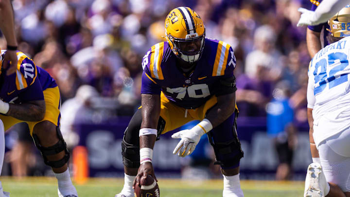 Sep 21, 2024; Baton Rouge, Louisiana, USA;  LSU Tigers offensive lineman DJ Chester (79) waits to snap the ball against UCLA Bruins defensive lineman Siale Taupaki (92) during the first half at Tiger Stadium. Mandatory Credit: Stephen Lew-Imagn Images